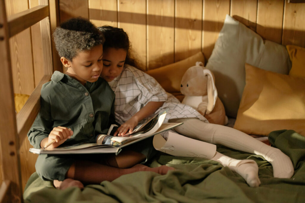 a boy and girl reading a book; Black Children's Books 