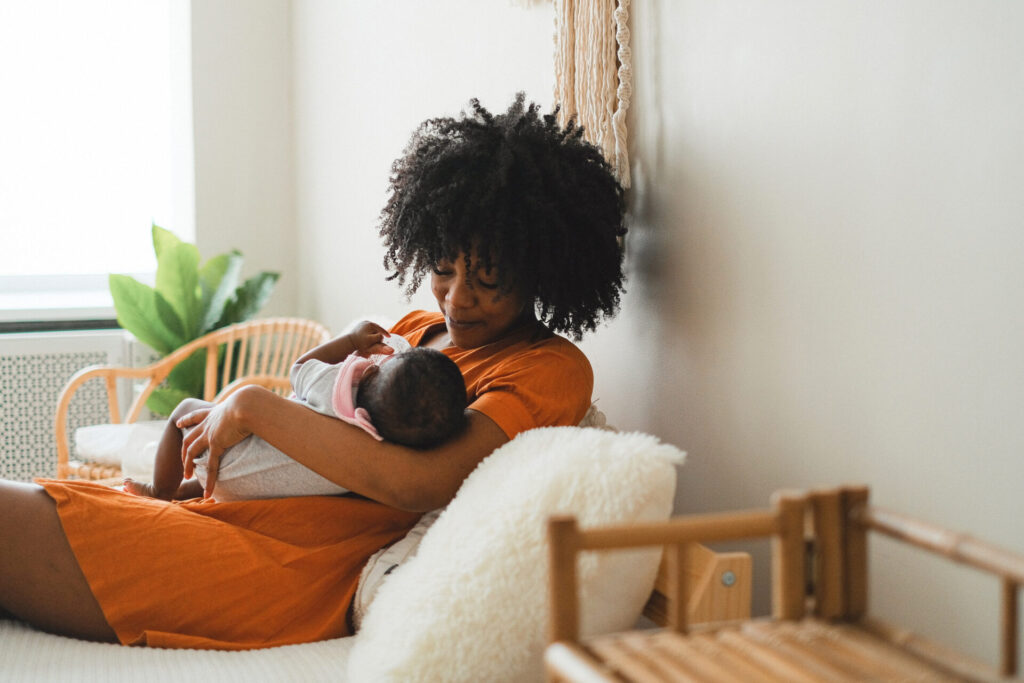A woman cuddling her baby