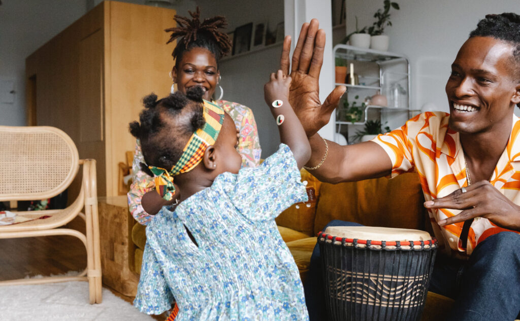 happy family doing high five; Black parenting blogs