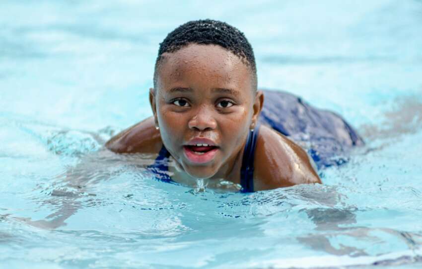 Kid Swimming in Pool