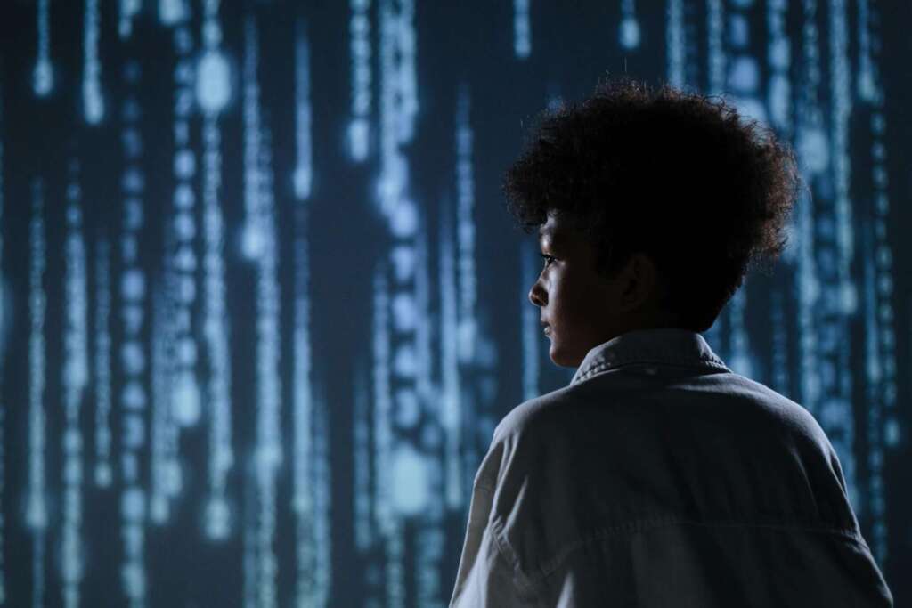 Mindful sharenting; Back View of A Teen Boy with a Digital Background
