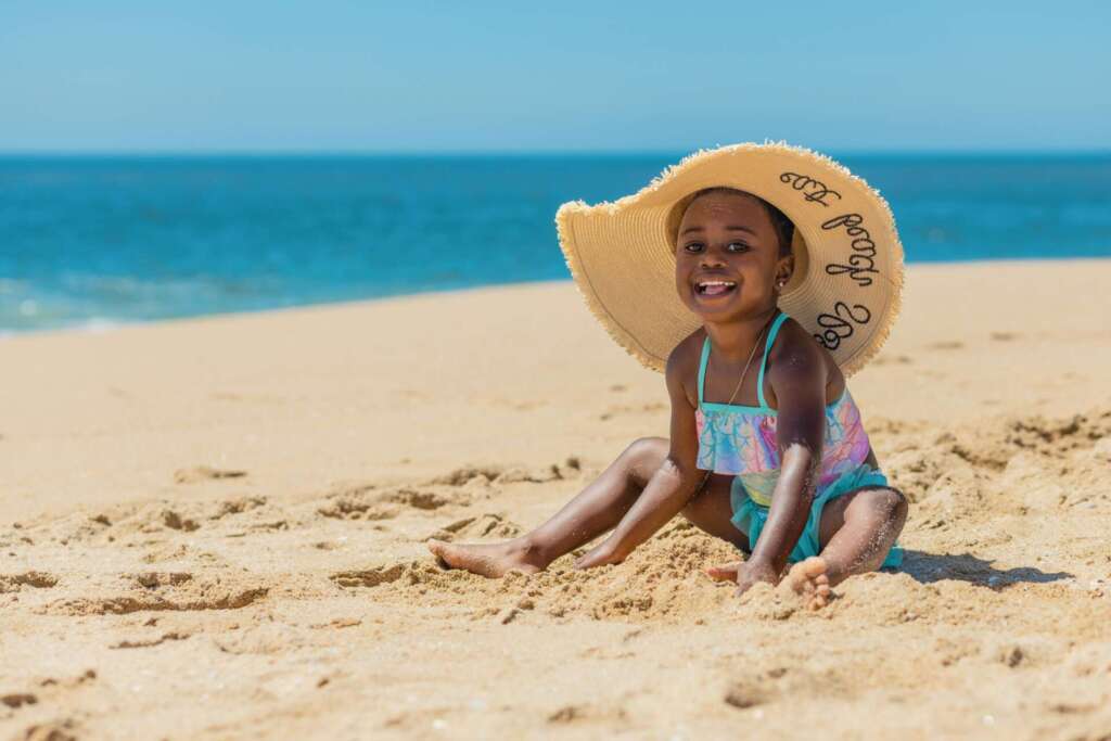 Heat wave tips; Shallow Focus of a Little Girl Playing with Beach Sand